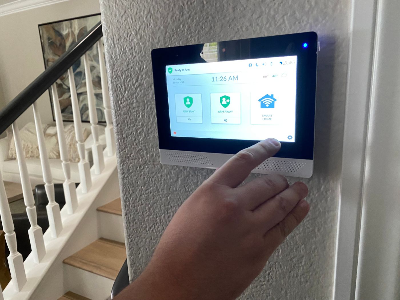 Technician performing a professional home security system installation