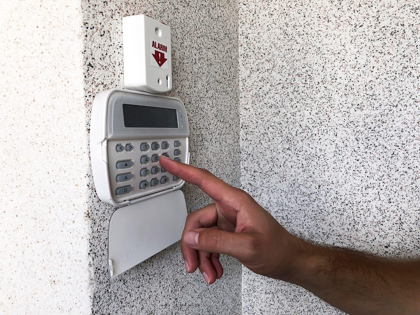 Person setting up security system monitoring in a Claremont home.