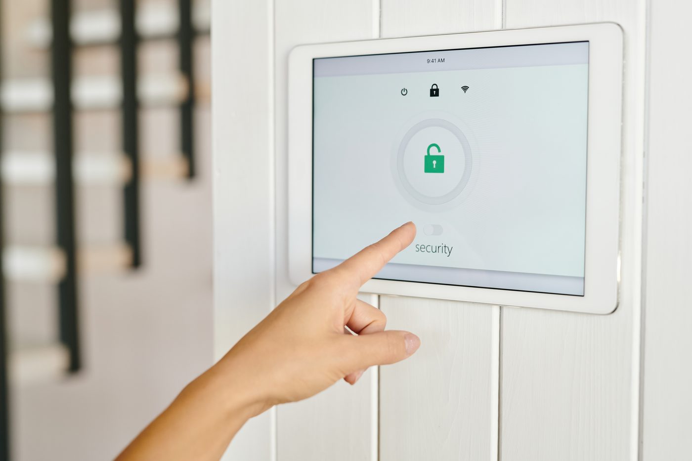 Person setting up security system monitoring in a Montclair home.